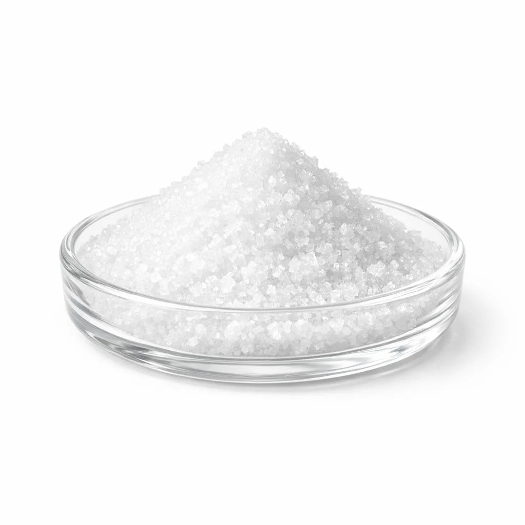 Fine white mineral crystals in a glass dish