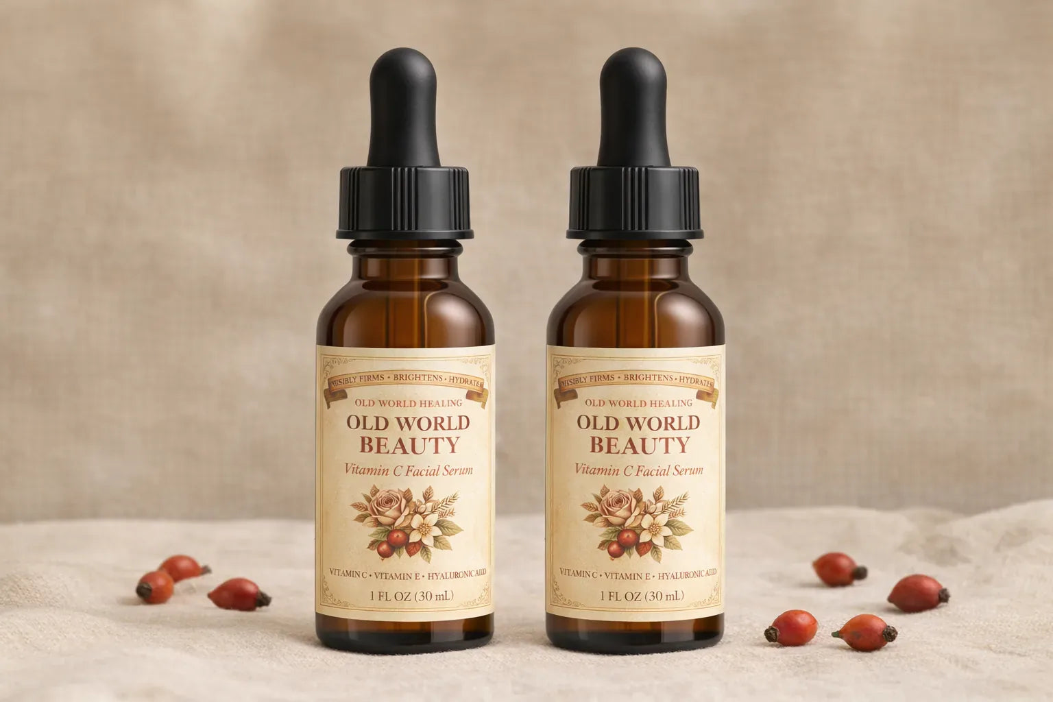 Two Old World Beauty bottles on warm cream linen with scattered rosehips