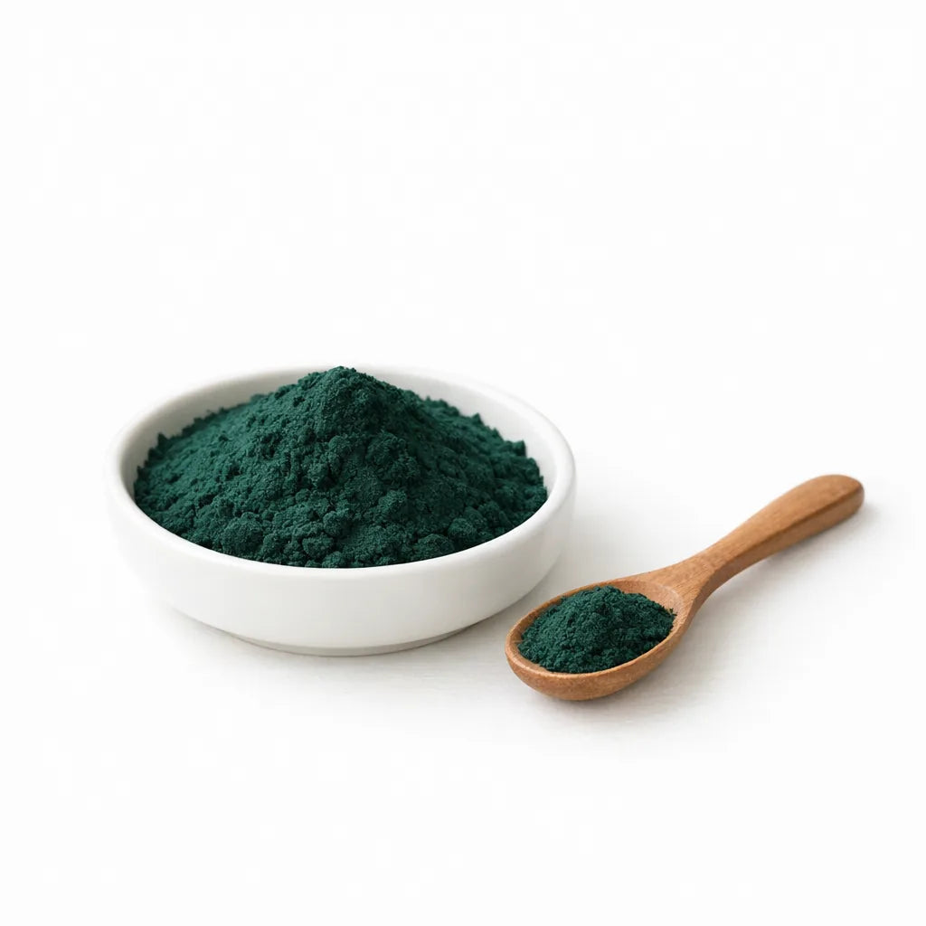 Deep blue-green spirulina powder in a dish