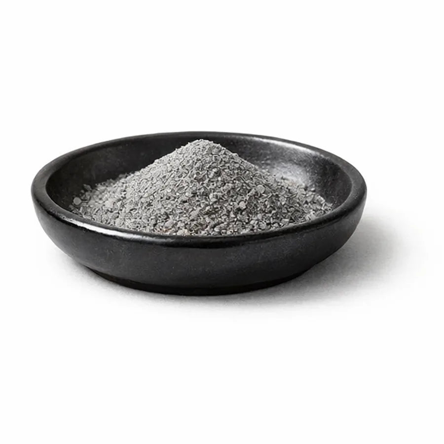 Chromium mineral granules in a dark dish