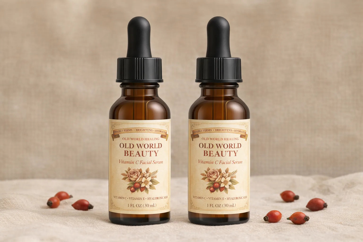 Two bottles of Old World Beauty on cream linen with scattered rosehips