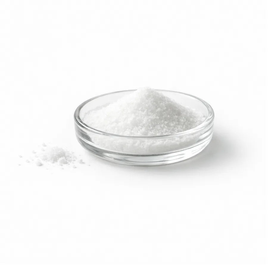 White taurine crystals in a glass dish